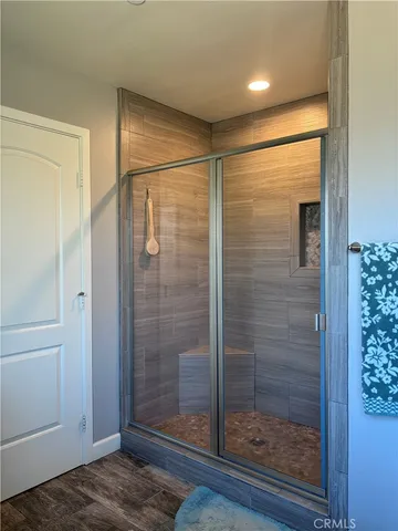 a bathroom with a shower and a sink