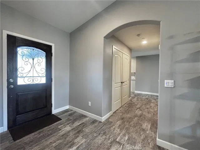 a view of hallway with wooden floor
