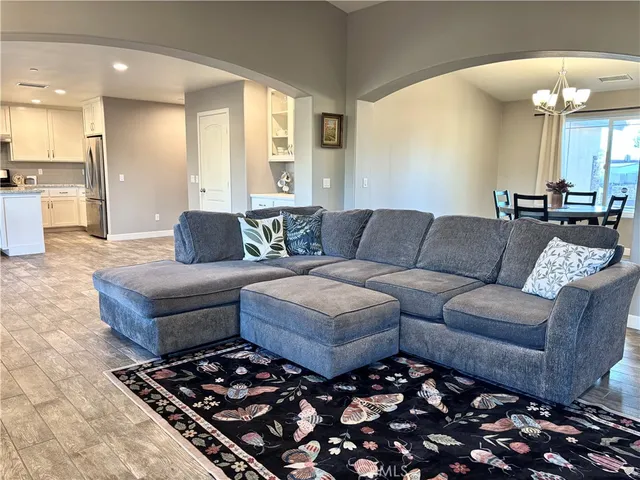 a living room with furniture and a rug