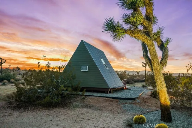 a view of a house with a yard and garage