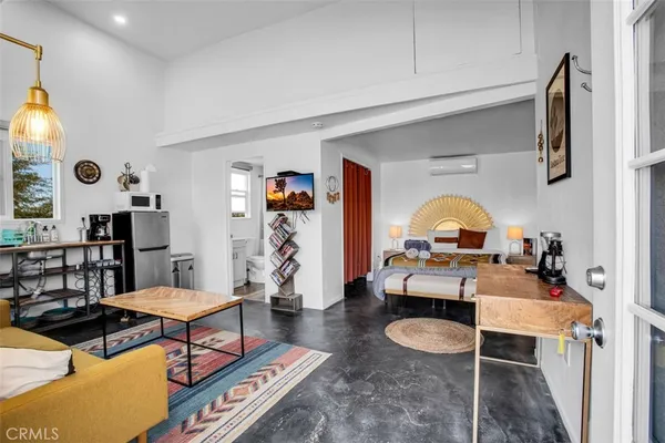a bedroom with a bed and a table in it