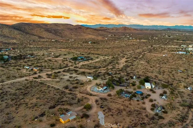 a view of yard with patio