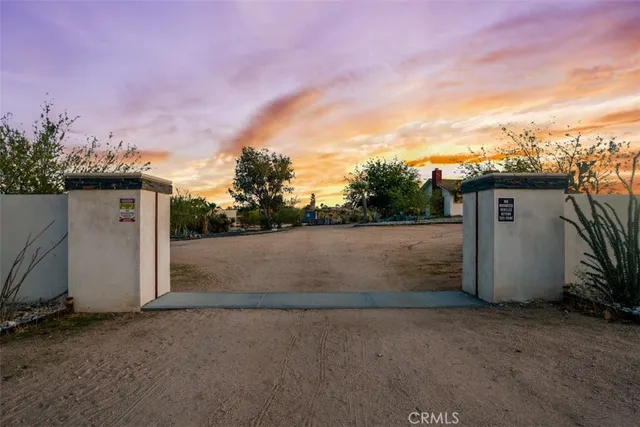 a view of a house with a porch and furniture