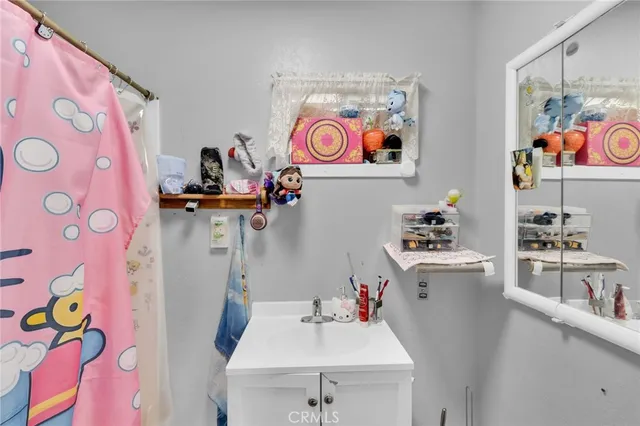 a room with a sink a stove and refrigerator