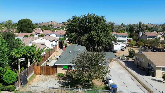 an aerial view of a house with a swimming pool