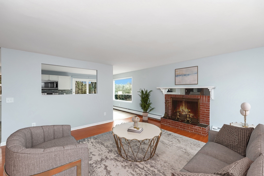 164 Sterling Road Lancaster, MA 01523 - Photo 11 of 36 a living room with furniture and a fireplace