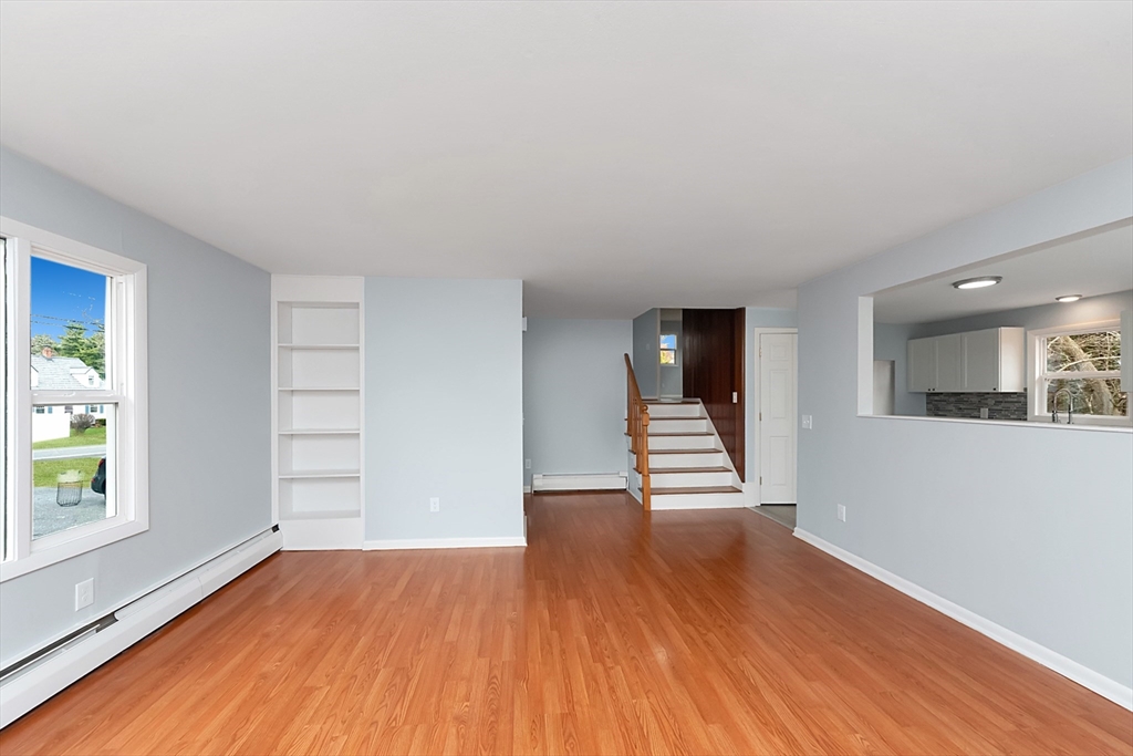 164 Sterling Road Lancaster, MA 01523 - Photo 13 of 36 wooden floor in an empty room with a window