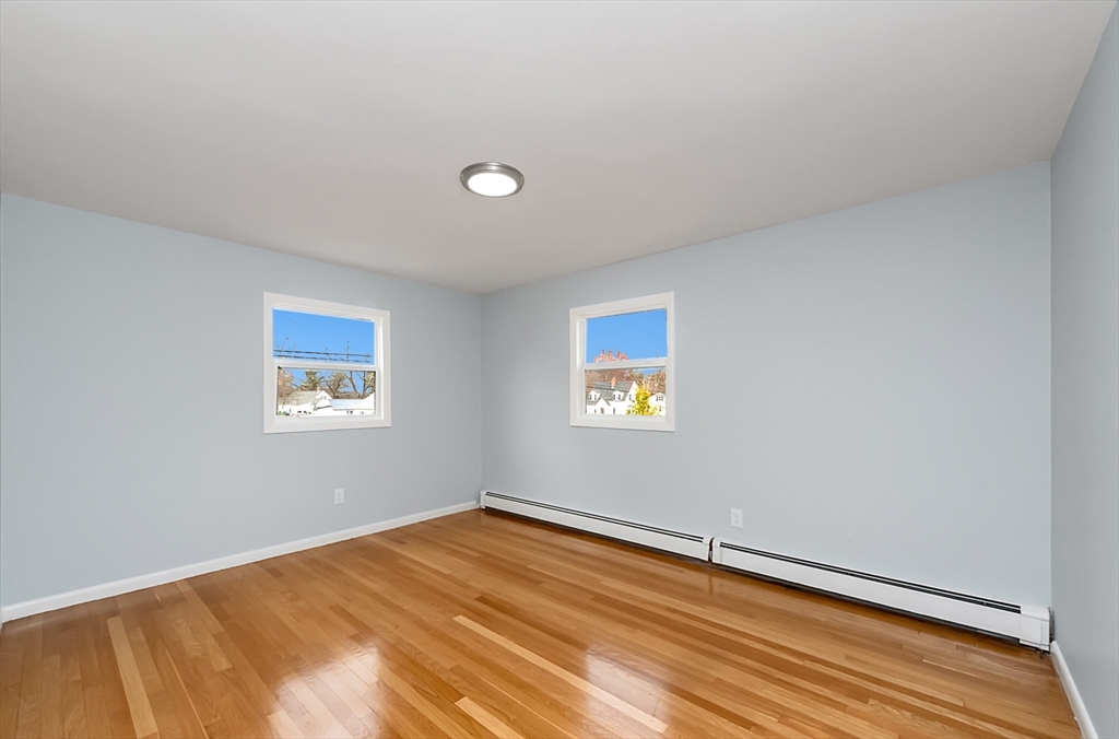 164 Sterling Road Lancaster, MA 01523 - Photo 17 of 36 a view of a room with a wooden floor and a window