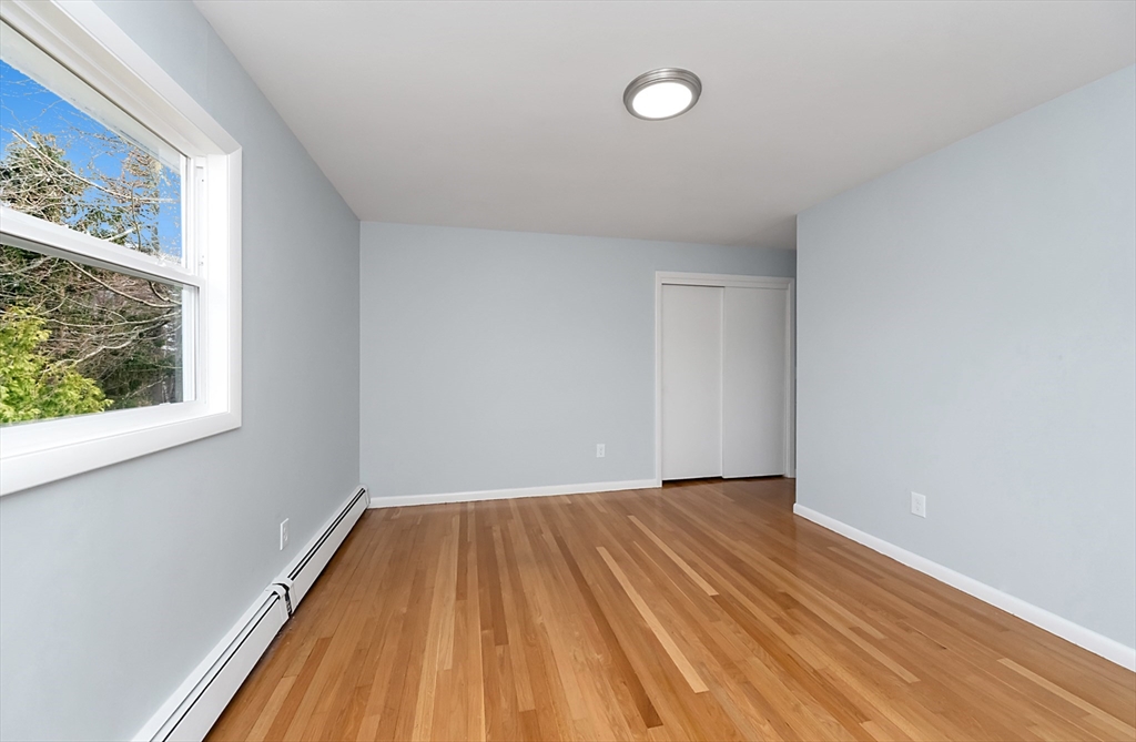 164 Sterling Road Lancaster, MA 01523 - Photo 19 of 36 a view of a room with wooden floor and small window