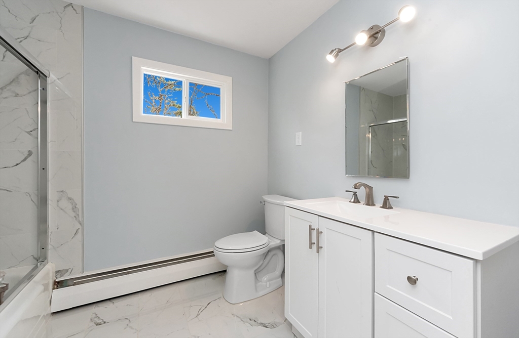 164 Sterling Road Lancaster, MA 01523 - Photo 20 of 36 a bathroom with a toilet sink and mirror