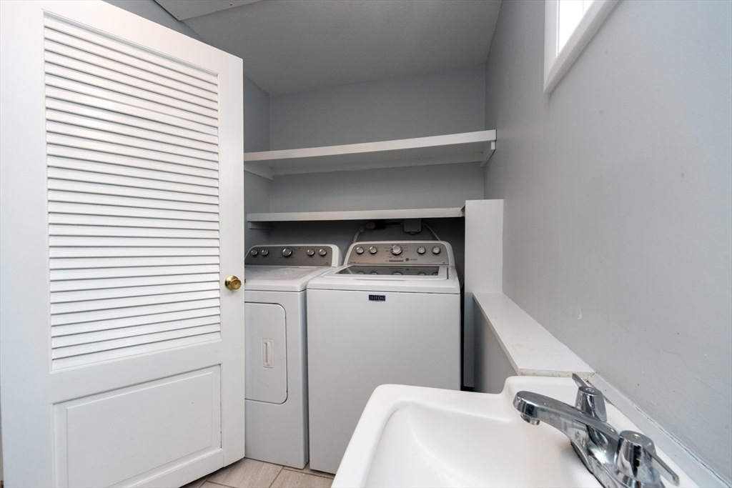 164 Sterling Road Lancaster, MA 01523 - Photo 23 of 36 a utility room with dryer and washer