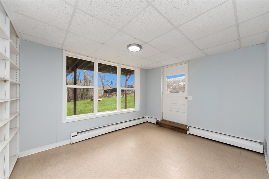 164 Sterling Road Lancaster, MA 01523 - Photo 27 of 36 an empty room with a empty space and windows