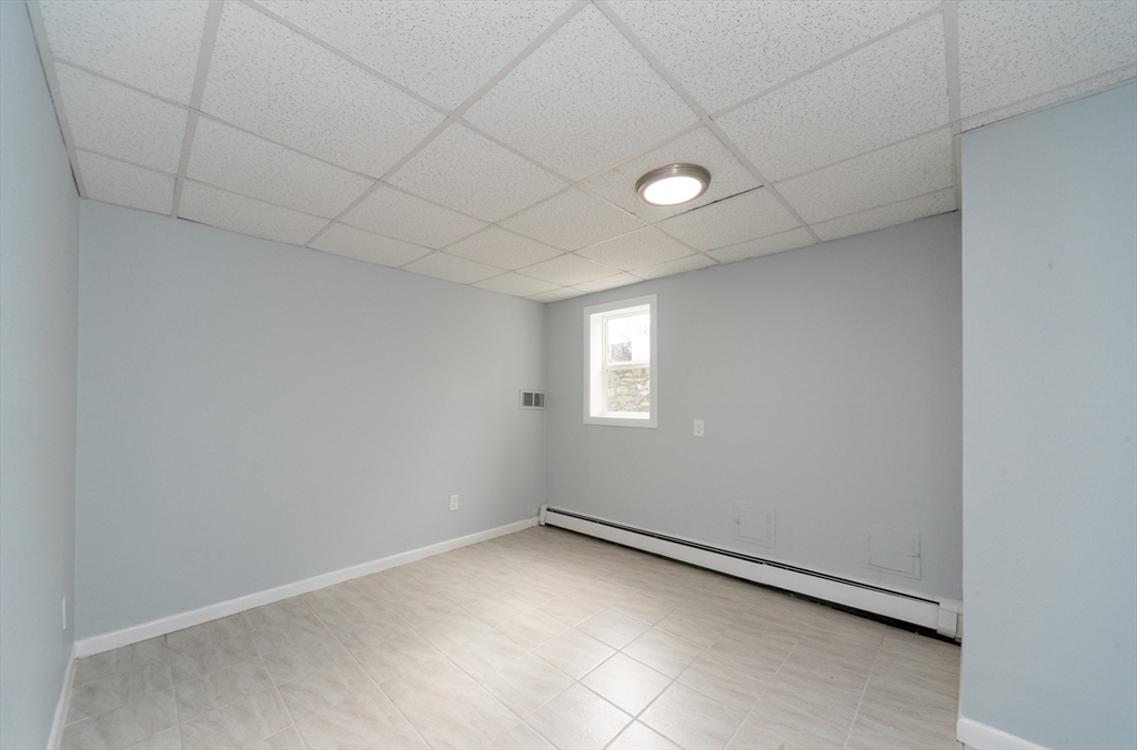 164 Sterling Road Lancaster, MA 01523 - Photo 28 of 36 wooden floor in an empty room with a window