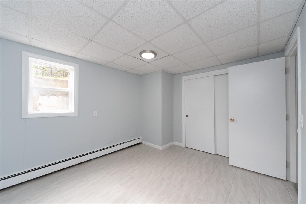 164 Sterling Road Lancaster, MA 01523 - Photo 29 of 36 a view of an empty room and a window