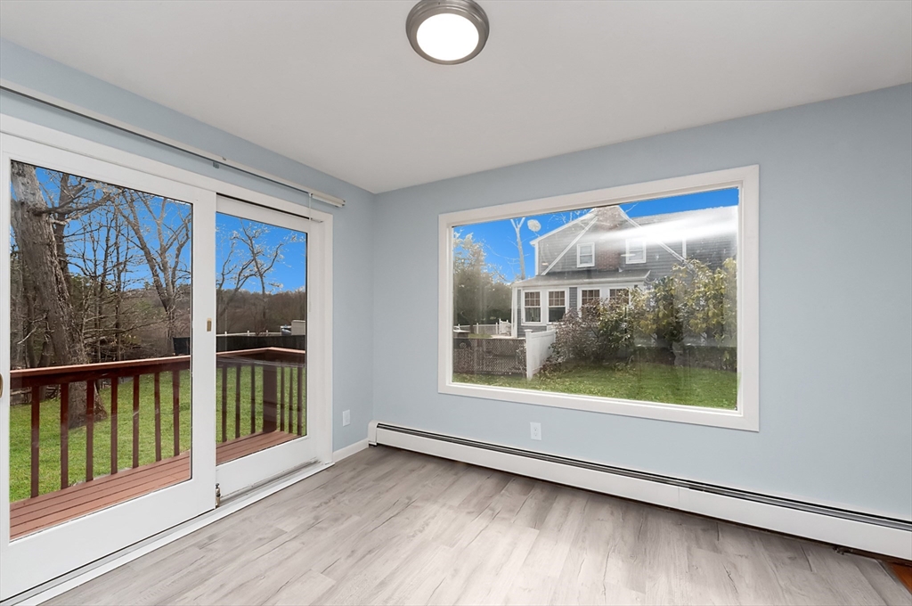 164 Sterling Road Lancaster, MA 01523 - Photo 8 of 36 a view of a room with wooden floor and a window