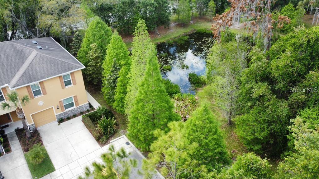 8301 Pine River Road Tampa, FL 33637 - Photo 2 of 16 an aerial view of a house with a yard