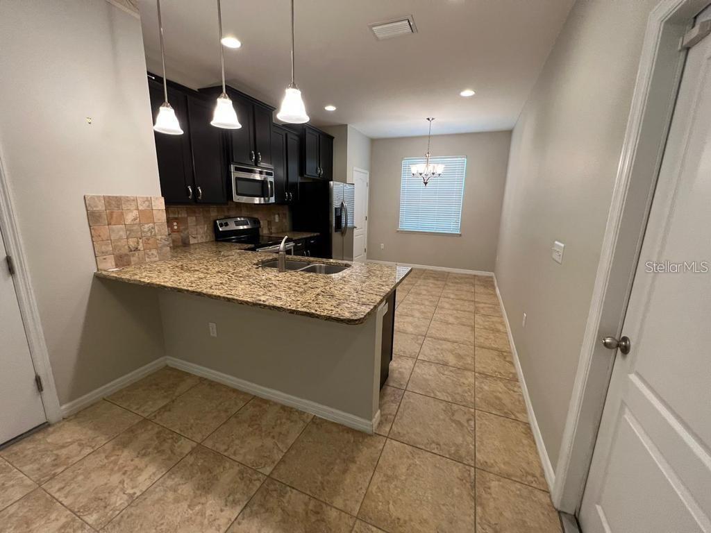8301 Pine River Road Tampa, FL 33637 - Photo 9 of 16 a bathroom with a sink a vanity and a mirror