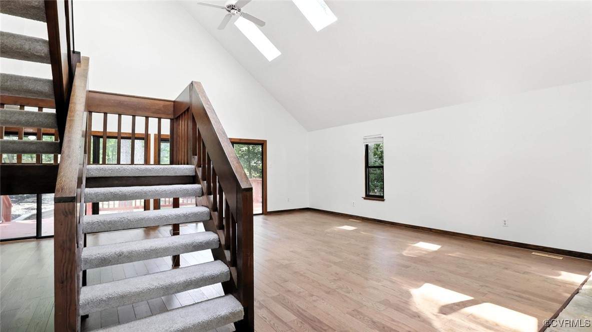 636 Spirea Road North Chesterfield, VA 23236 - Photo 13 of 47 Stairs with high vaulted ceiling, a skylight, wood
