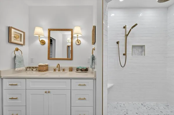 a bathroom with a sink a toilet and shower curtain