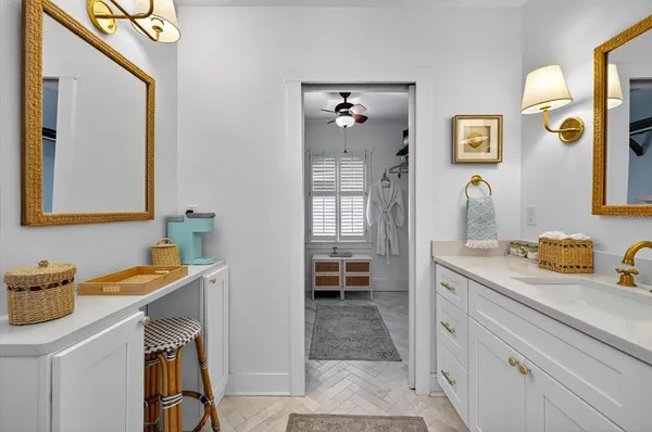 a view of a yard with plants and palm trees
