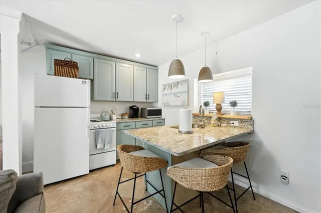 a bathroom with a sink a toilet and shower curtain