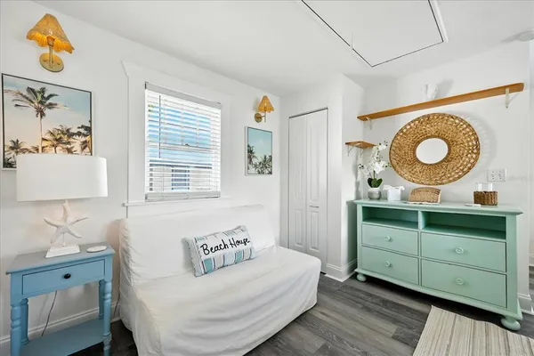 an aerial view of residential houses with outdoor space and trees