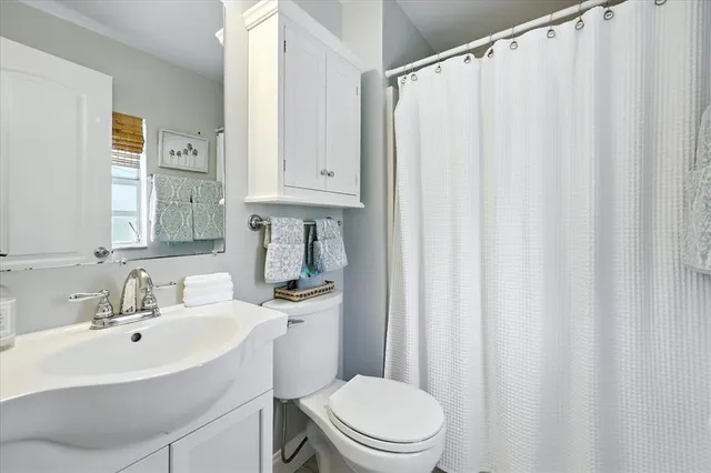 a view of living room with furniture and large windows