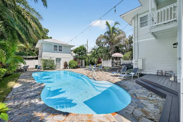 a view of a deck with furniture and wooden floor