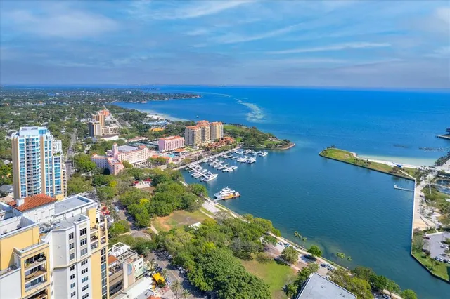 a bedroom with a bed furniture and a flat screen tv