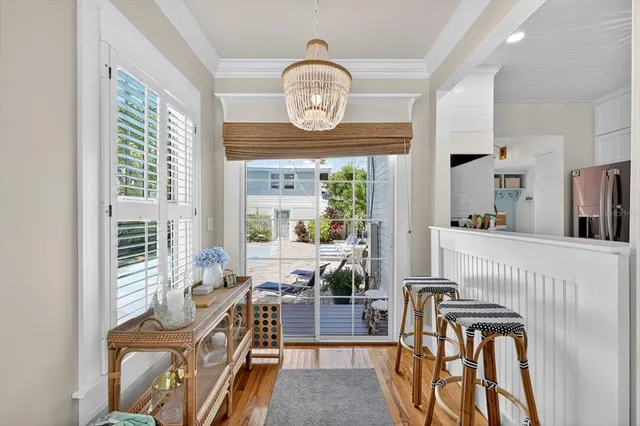 a kitchen with granite countertop a sink a stove and cabinets