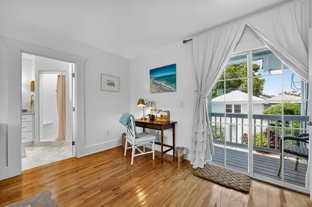 an aerial view of multiple houses with yard