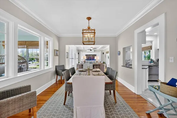 a kitchen with granite countertop a sink a stove and cabinets