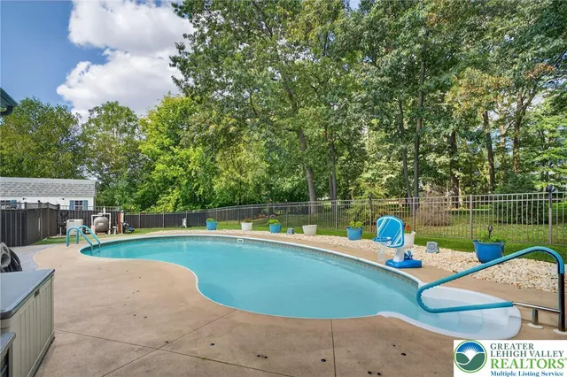 a kitchen with stainless steel appliances granite countertop a stove a refrigerator and a microwave