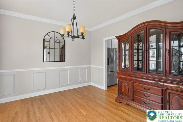 a bathroom with a granite countertop sink and mirror with bathtub