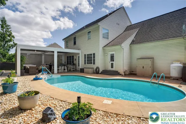 a view of a patio with a dining table and chairs with wooden floor