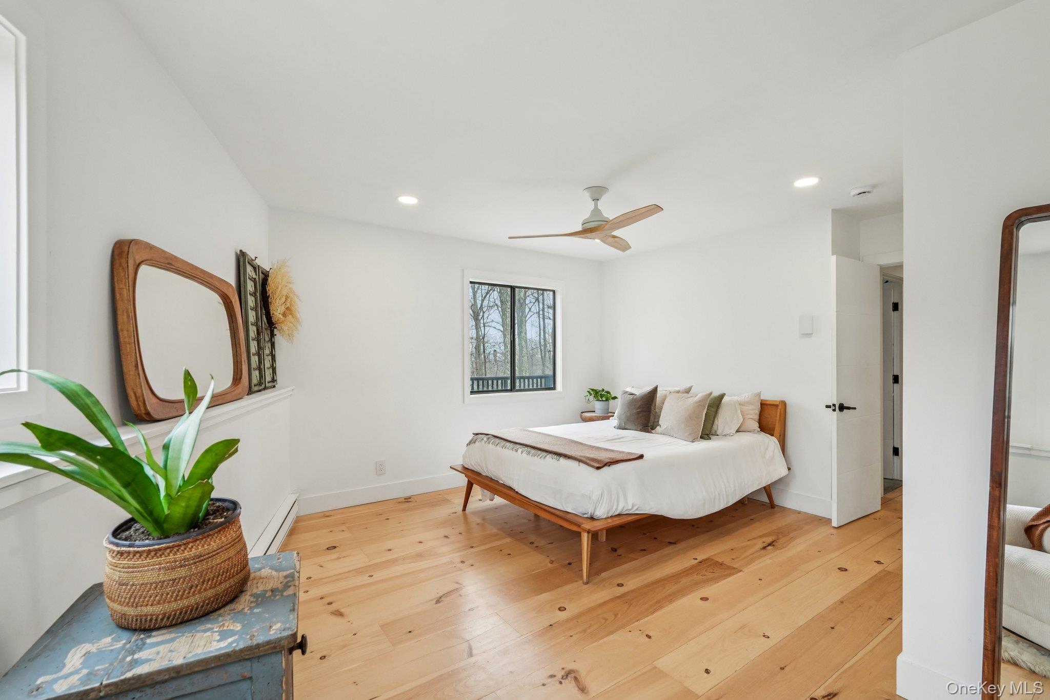 4 Mountain Brook Road Cornwall, NY 12518 - Photo 17 of 45 Bedroom featuring light wood finished floors, a ceiling fan, a baseboard heating unit, and recessed lighting