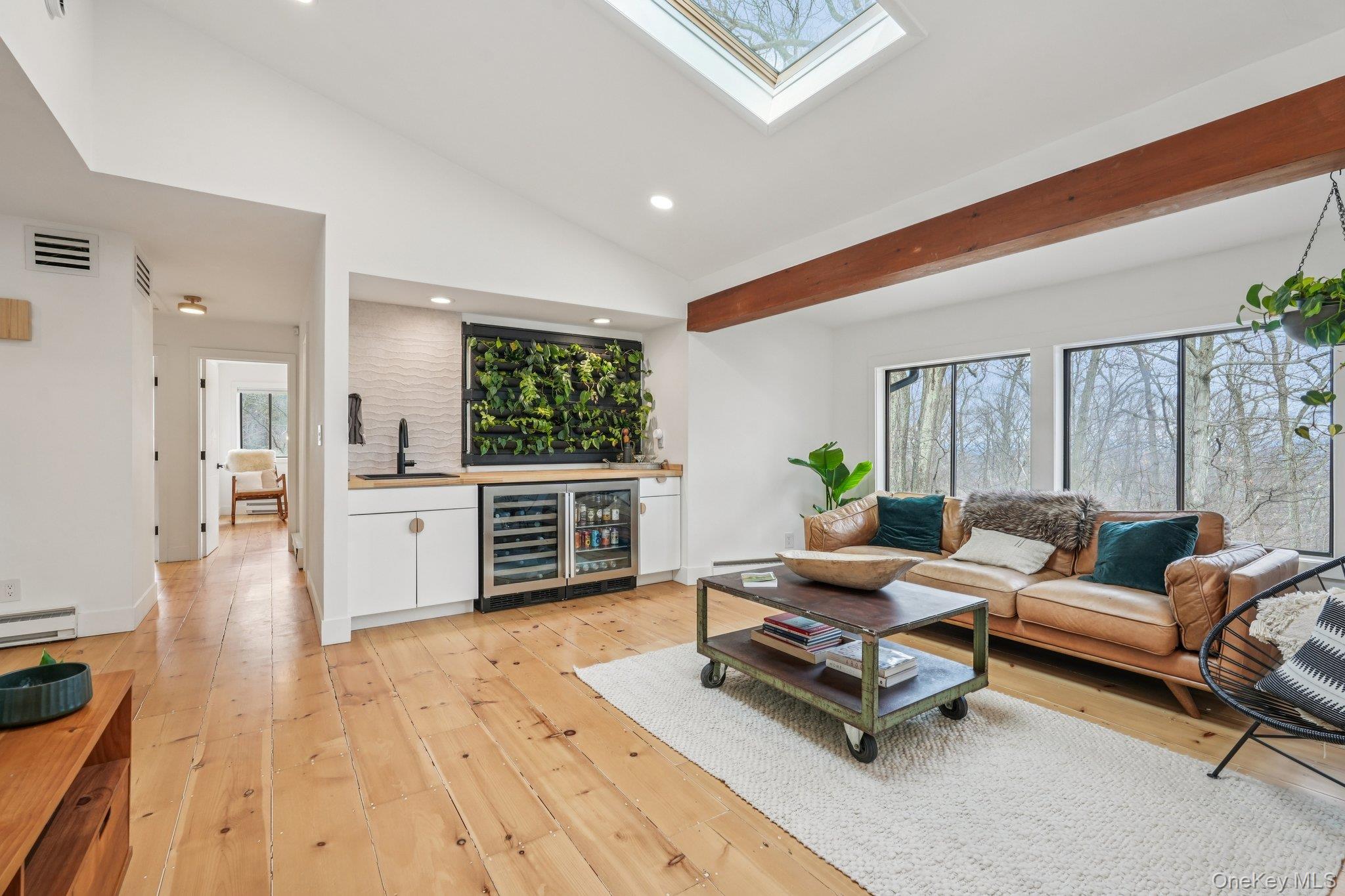 4 Mountain Brook Road Cornwall, NY 12518 - Photo 22 of 45 Custom wet bar with wine fridge and beverage fridge for effortless entertaining and live plant feature wall