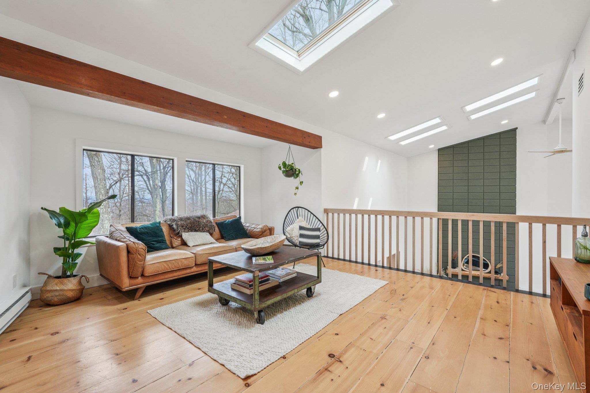 4 Mountain Brook Road Cornwall, NY 12518 - Photo 23 of 45 Living room with light wood-style floors, lofted ceiling, a skylight, and recessed lighting with custom wet bar