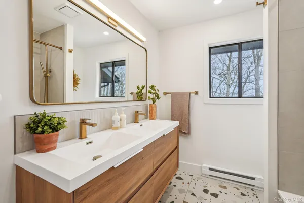 a bathroom with a sink and a mirror