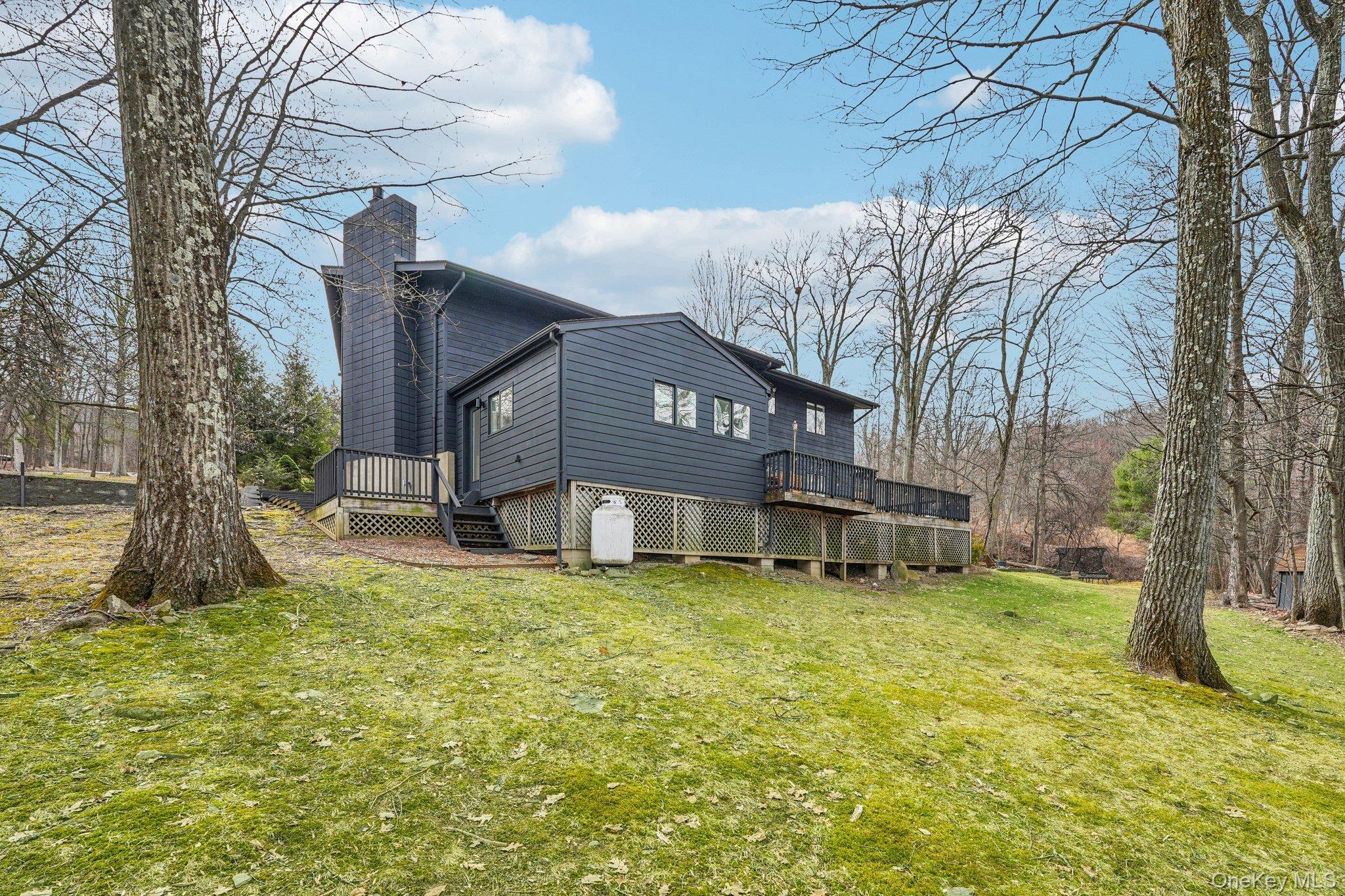 4 Mountain Brook Road Cornwall, NY 12518 - Photo 34 of 45 Back of house with a wooden deck, a chimney, and a lawn