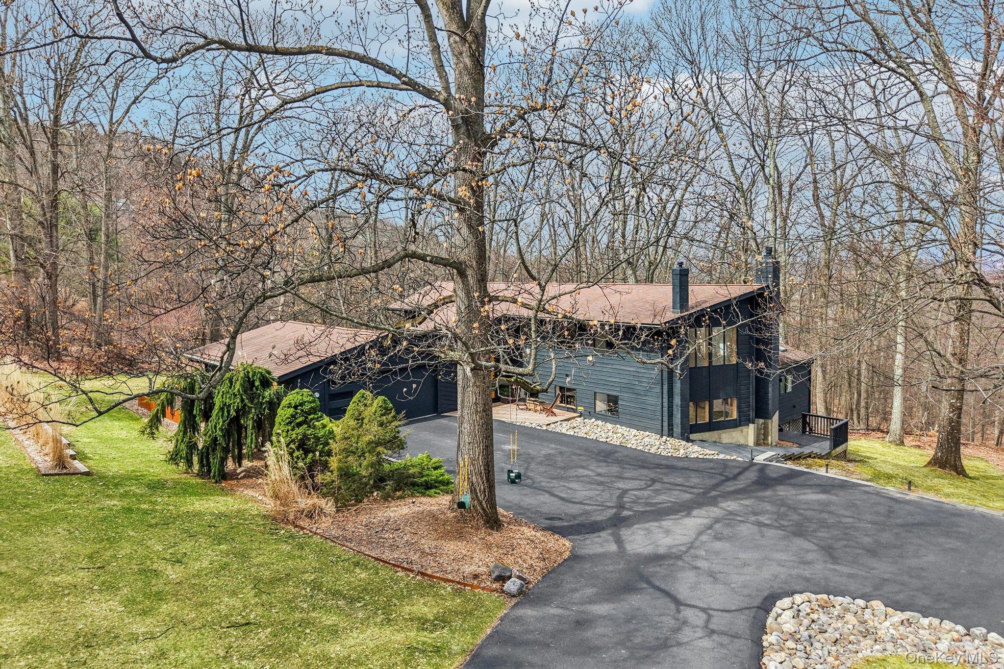 4 Mountain Brook Road Cornwall, NY 12518 - Photo 35 of 45 View of front of house with a chimney, a front lawn, asphalt driveway, and an attached garage