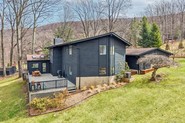 a house with trees in the background