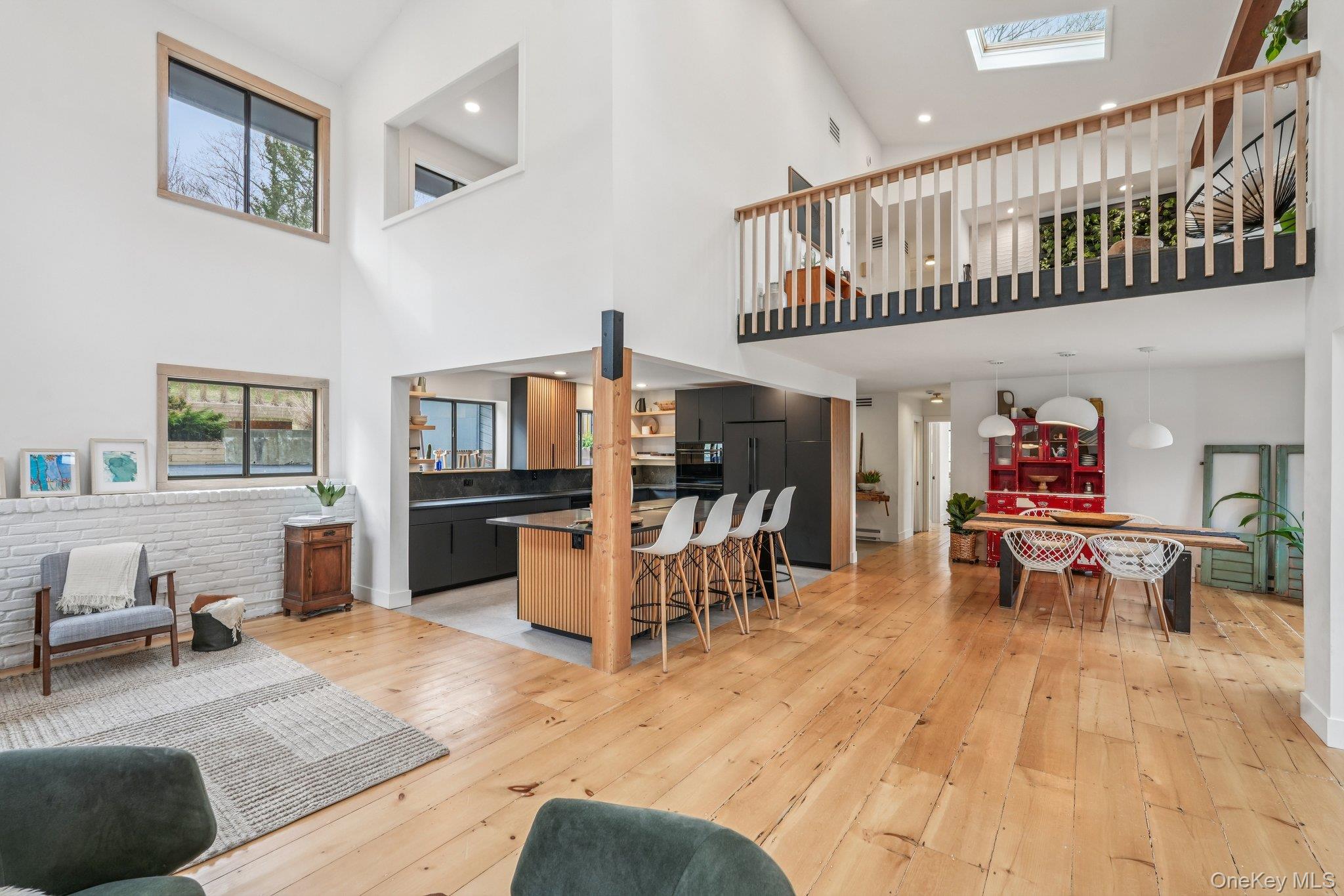 4 Mountain Brook Road Cornwall, NY 12518 - Photo 4 of 45 Living area featuring light wood finished floors, a skylight, and a high ceiling