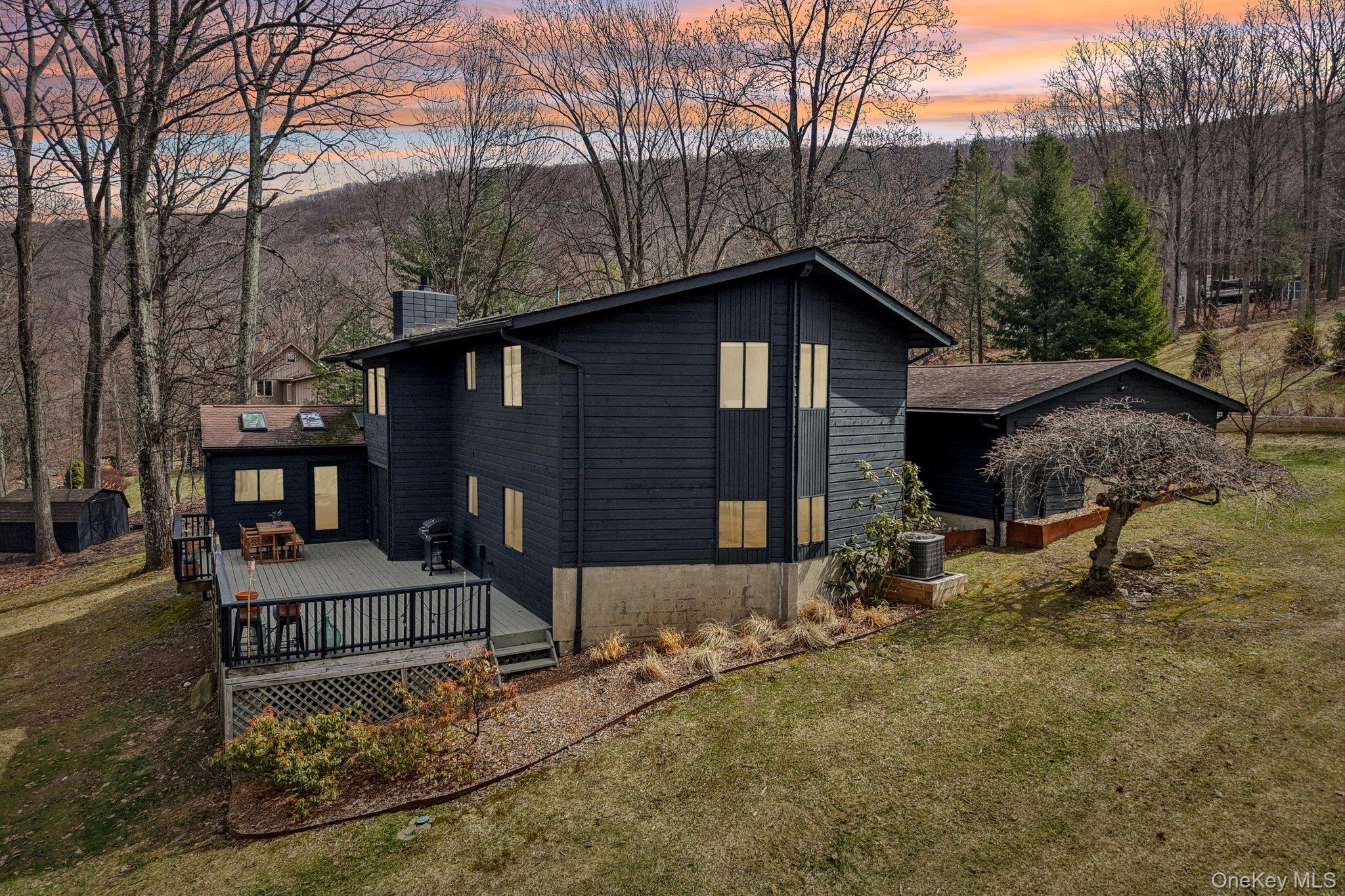 4 Mountain Brook Road Cornwall, NY 12518 - Photo 43 of 45 Property exterior at dusk with a deck, a chimney, and a yard