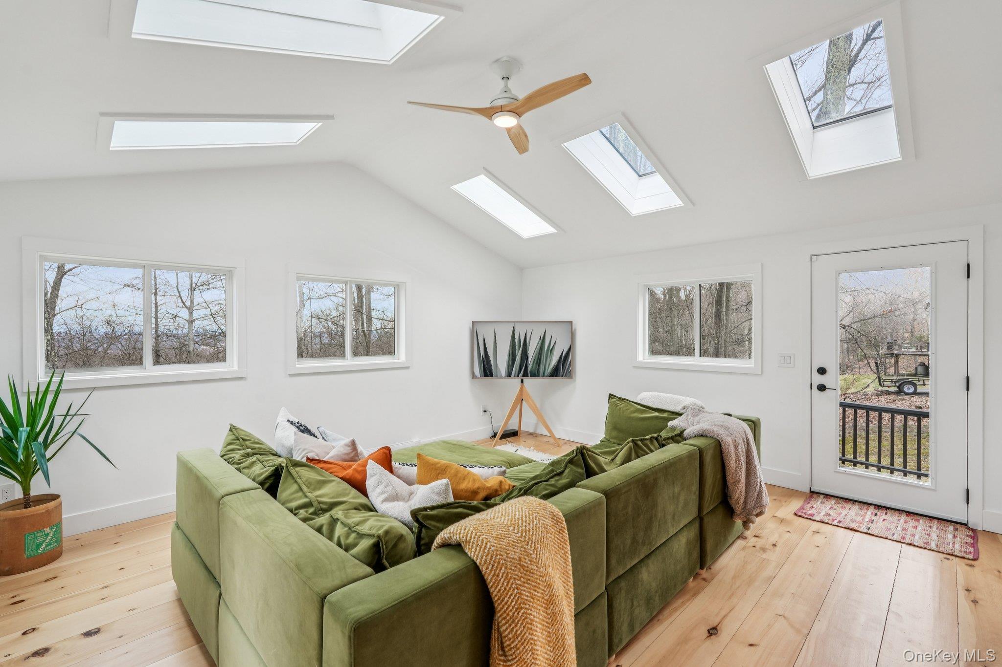 4 Mountain Brook Road Cornwall, NY 12518 - Photo 10 of 45 Living area featuring a ceiling fan, light wood-style flooring, a skylight, and lofted ceiling