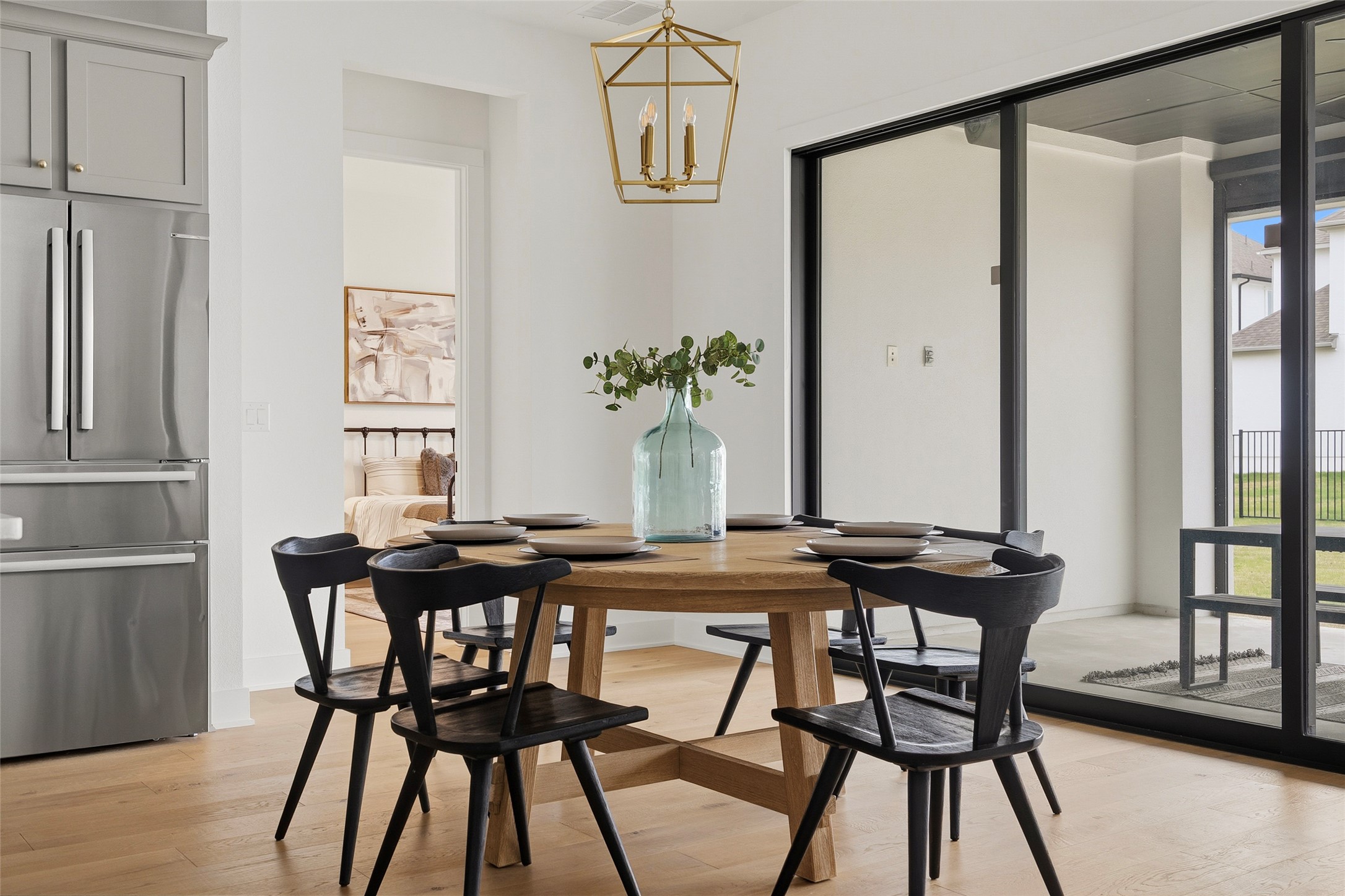 5009 Forenza Trace Leander, TX 78641 - Photo 14 of 39 a view of a dining room with furniture window and wooden floor