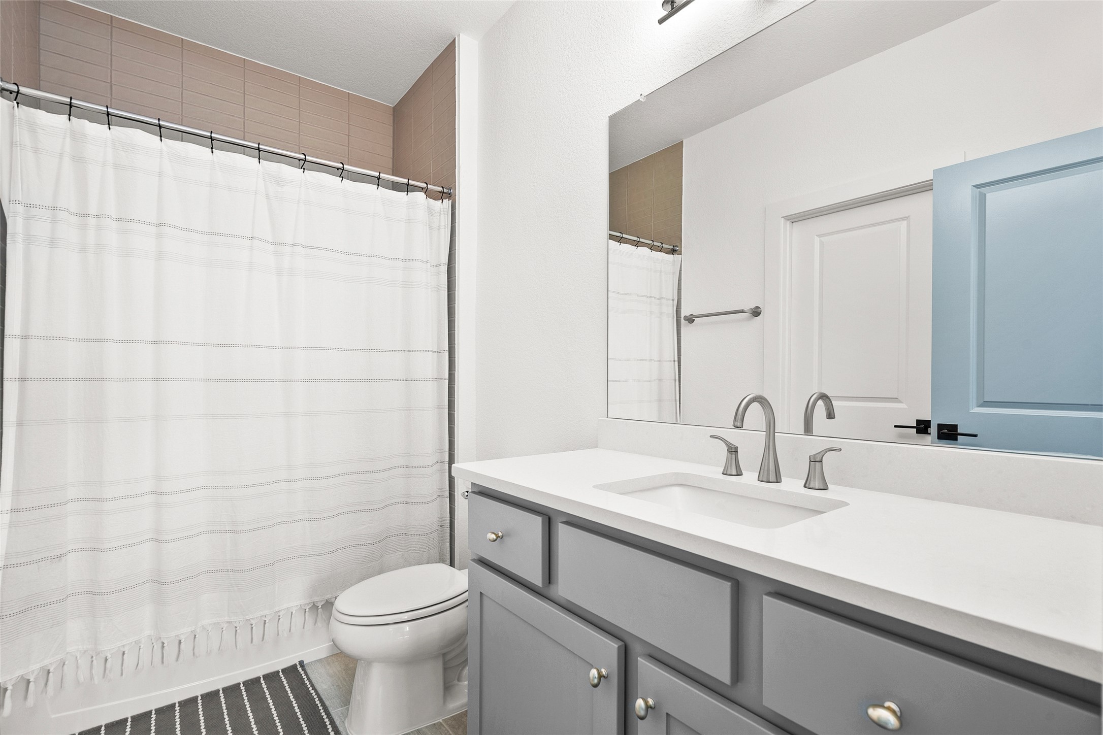 5009 Forenza Trace Leander, TX 78641 - Photo 28 of 39 a bathroom with a sink toilet and shower
