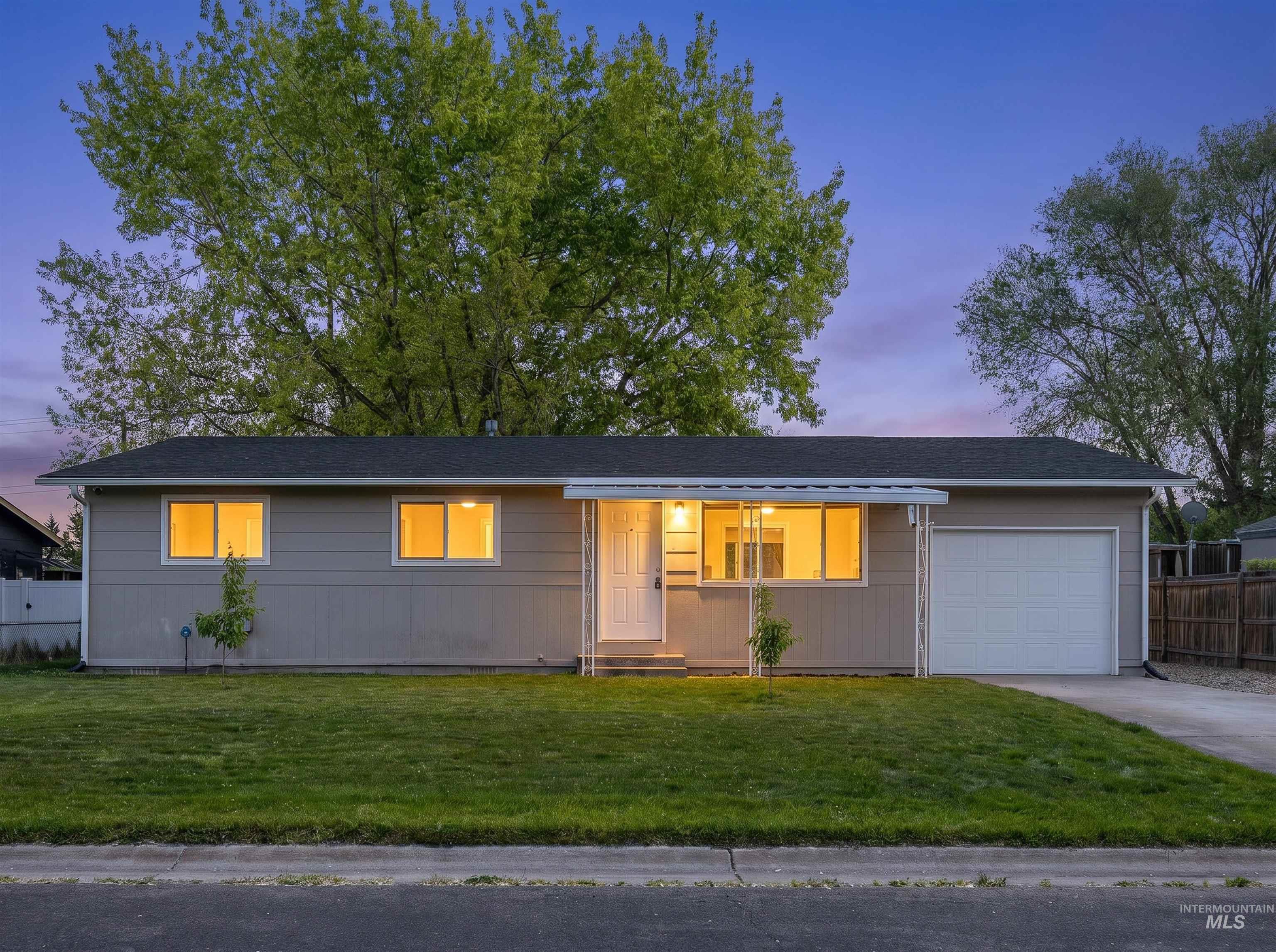 9 Villa Drive Middleton, ID 83644 - Photo 1 of 33 Wonderful Single-story Home featuring a neutral-toned exterior, a dark shingle roof, and an attached garage with a white door
