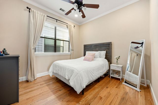 a view of a house with a yard and table and chairs