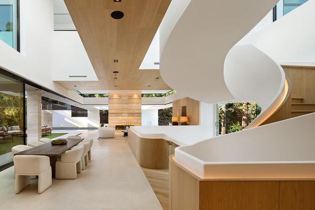 a kitchen that has a lot of cabinets in it and appliances